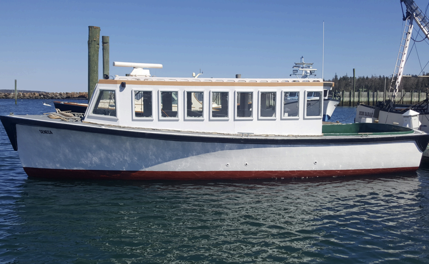 a boat is docked next to a body of water