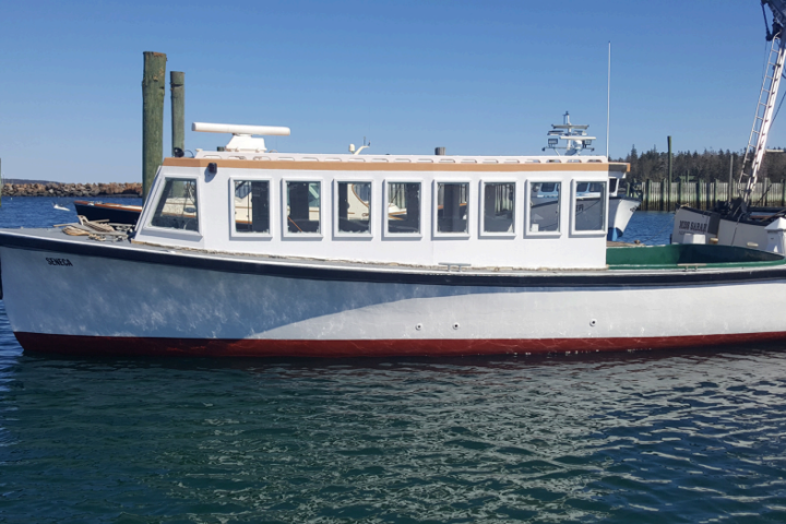 a boat is docked next to a body of water