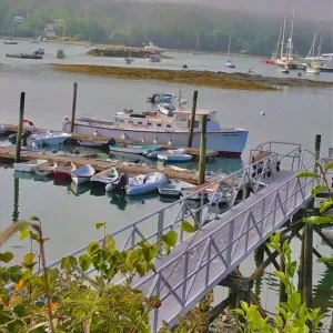 a boat is docked next to a body of water