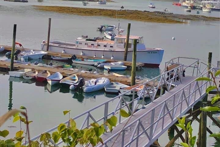 a boat is docked next to a body of water