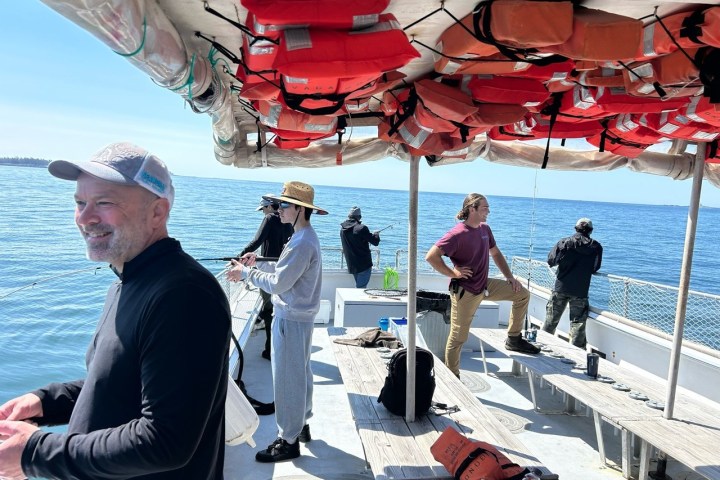 a group of people on a boat in the water